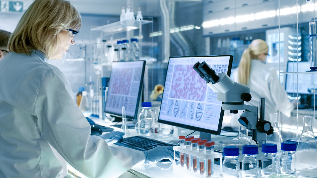 |Medical Research Scientists Examines Laboratory Mice kept in a Glass Cage. She Works in a Light Laboratory.||